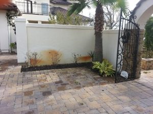 Well water rust stains located on stucco wall from sprinkler system
